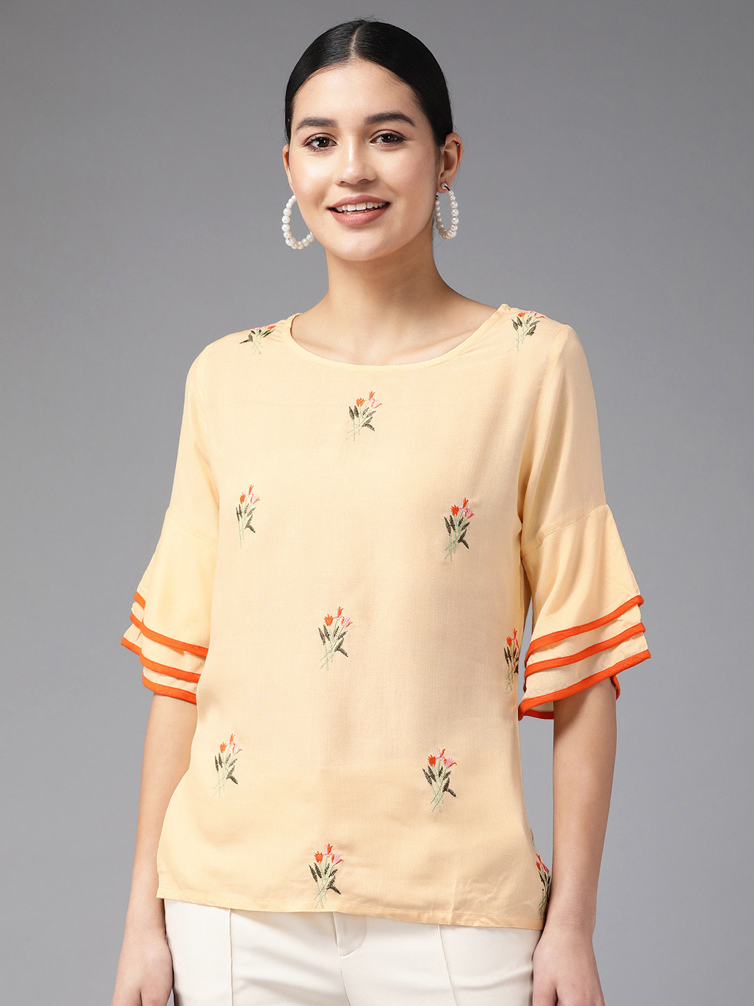 

Amirah s Peach-Coloured Floral Embroidered Top