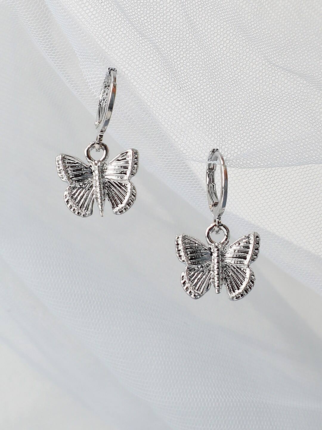 

SOHI Silver Plated Contemporary Drop Earrings