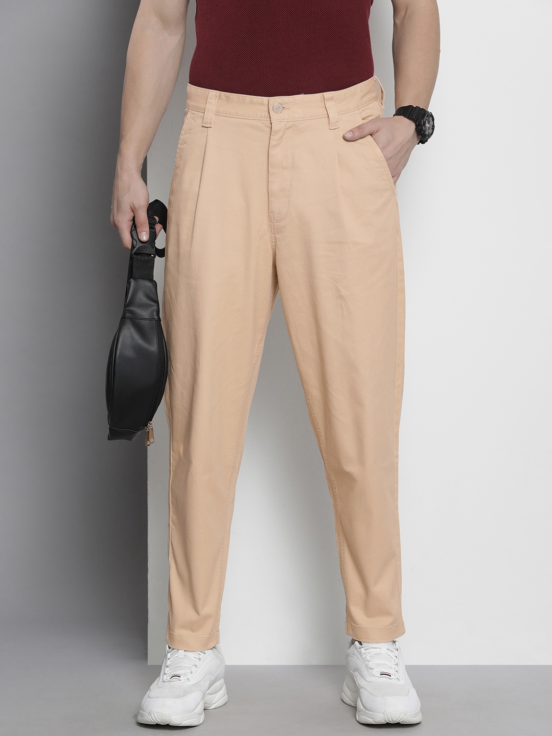 

Tommy Hilfiger Men Loose Tapered Fit Pleated Casual Trousers, Beige