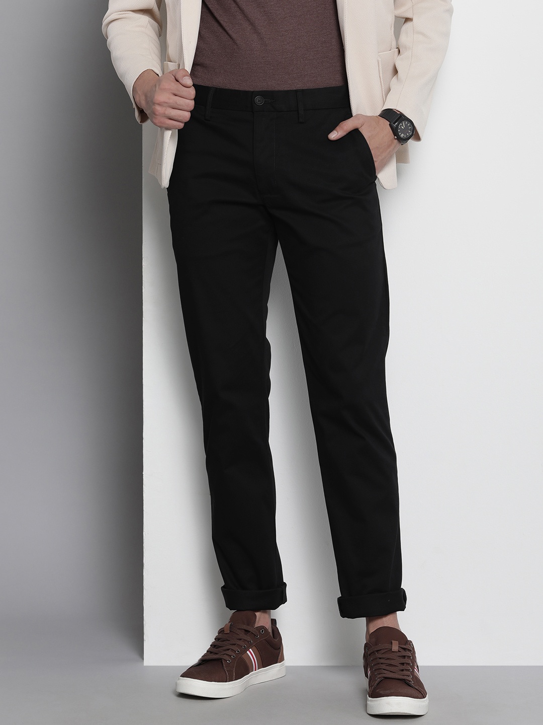 

Tommy Hilfiger Men Solid Mid-Rise Casual Trousers, Black
