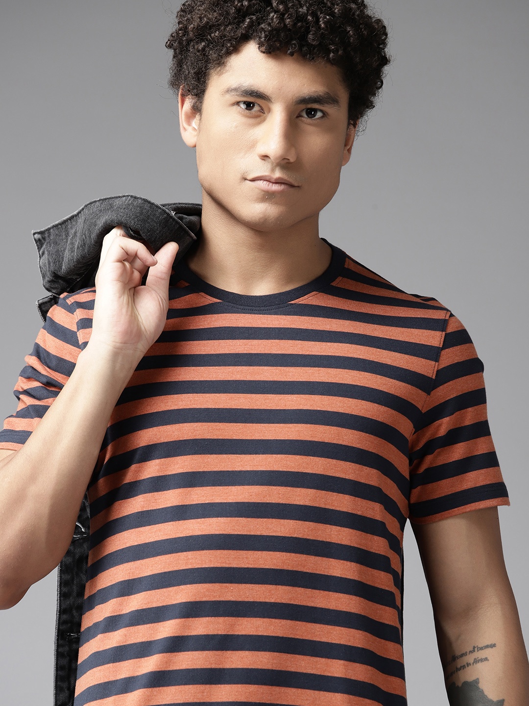 

The Roadster Lifestyle Co. Men Striped T-shirt, Orange
