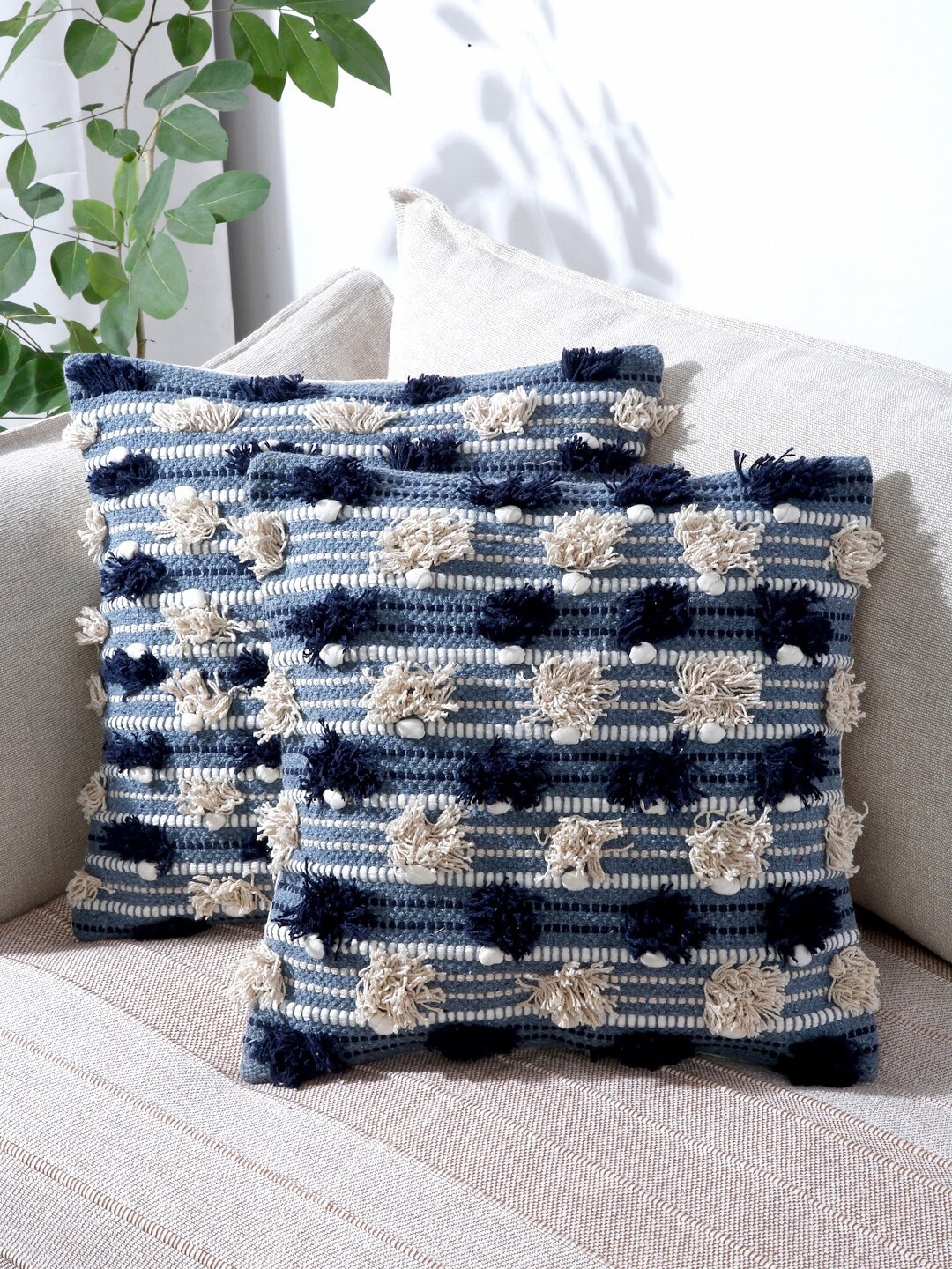 

Sangria Blue & Off White Set of 2 Self Design Cotton Square Cushion Covers