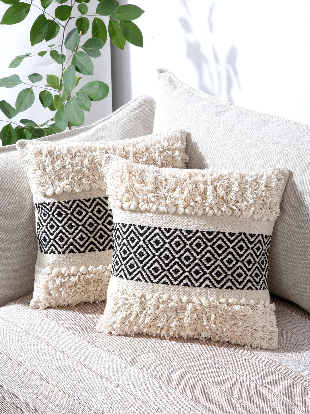 

Sangria Off White & Black Set of 2 Self Design Cotton Square Cushion Covers