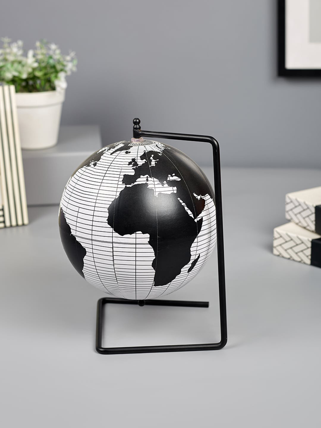 

HomeTown Black & White Globe Patterned Metal Showpiece
