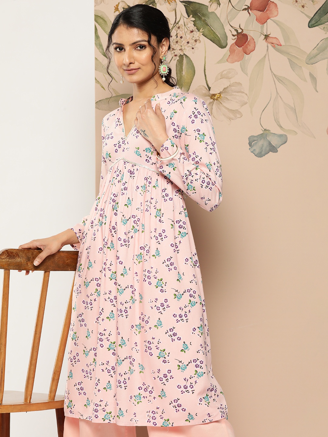 

Sangria Floral Printed Gotta Patti Detailed Empire Kurta with Flared Trousers, Peach