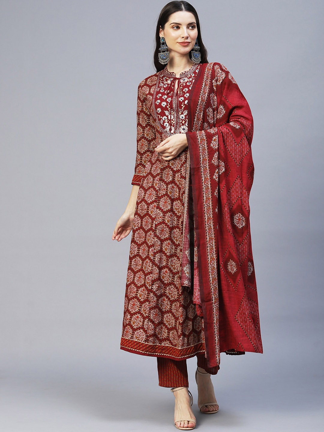 

FASHOR Women Maroon Ethnic Motifs Printed Empire Thread Work Kurta with Trousers & With Dupatta