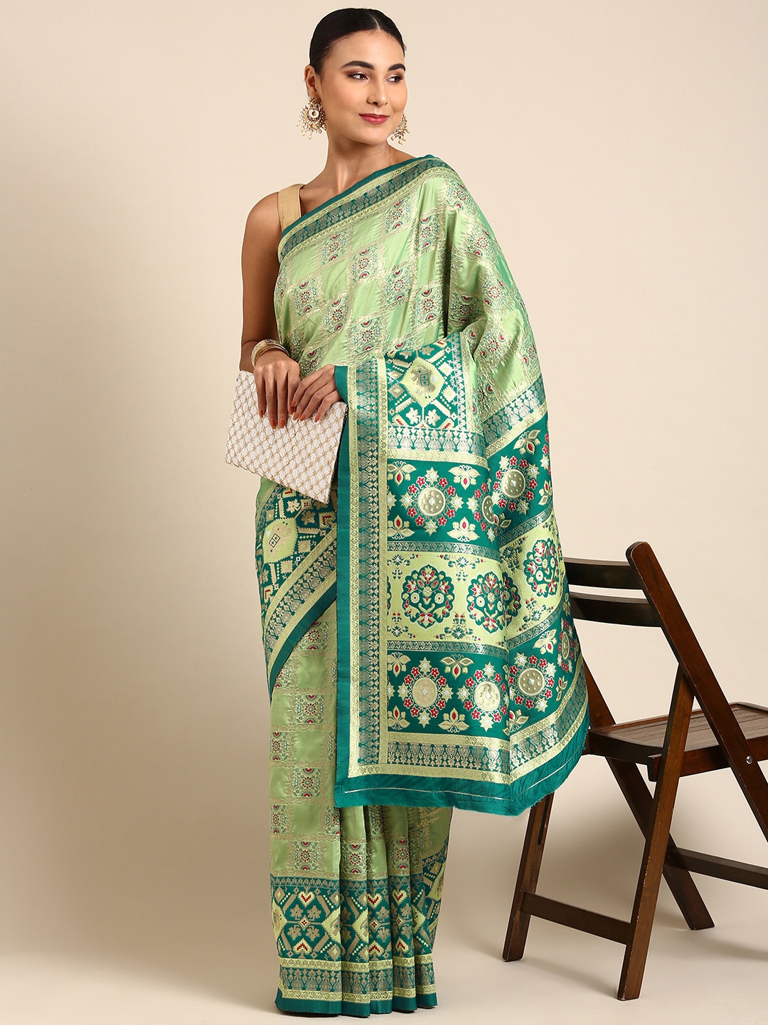 

Mitera Green & Gold-Toned Ethnic Motifs Zari Silk Blend Banarasi Patola Saree