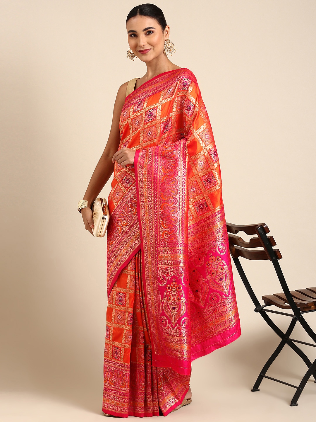 

Mitera Orange & Pink Ethnic Motifs Zari Silk Blend Banarasi Patola Saree