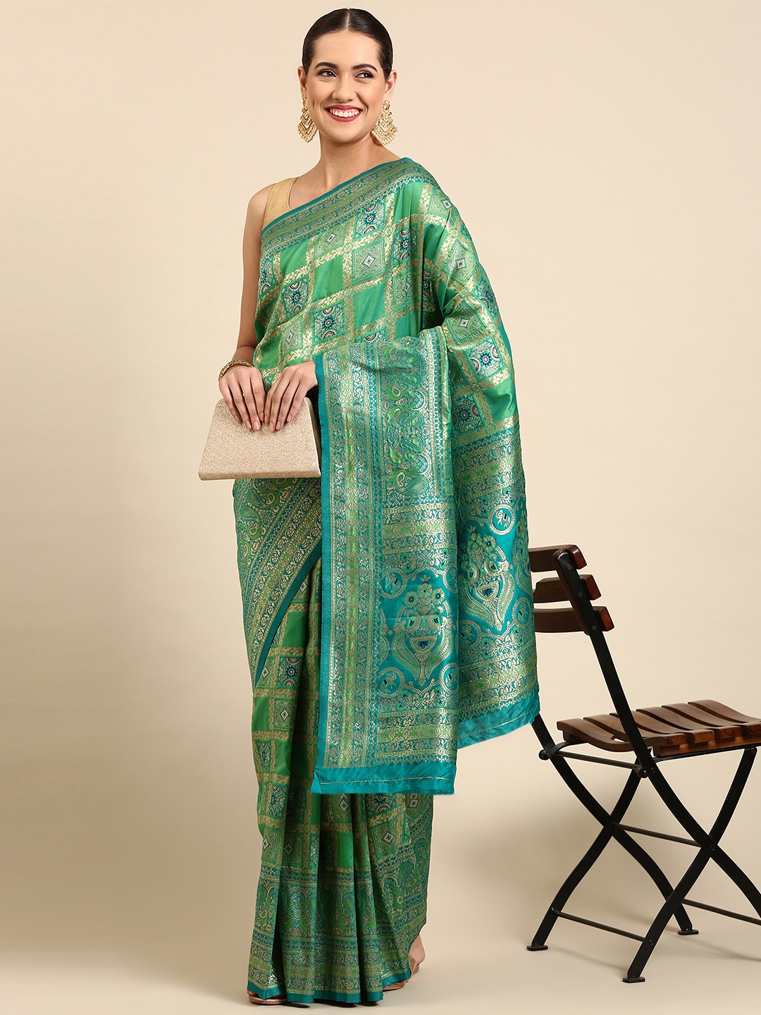 

Mitera Green & Gold-Toned Ethnic Motifs Zari Silk Blend Banarasi Patola Saree