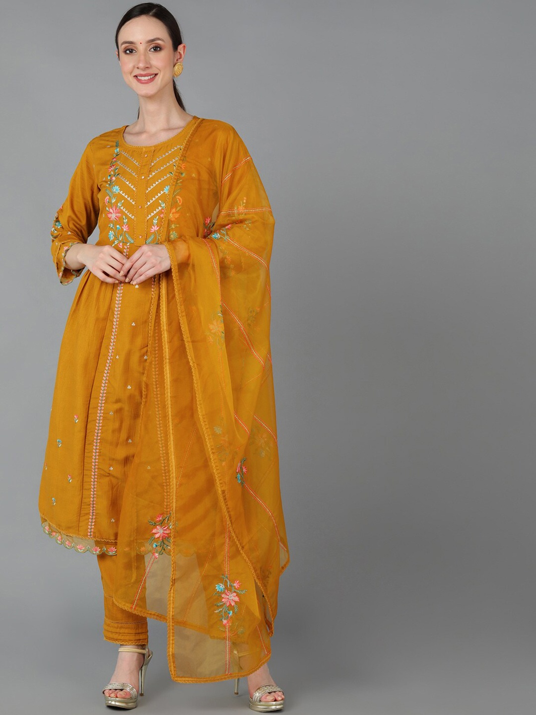 

AHIKA Women Floral Embroidered Panelled Thread Work Kurta with Trousers & Dupatta, Mustard