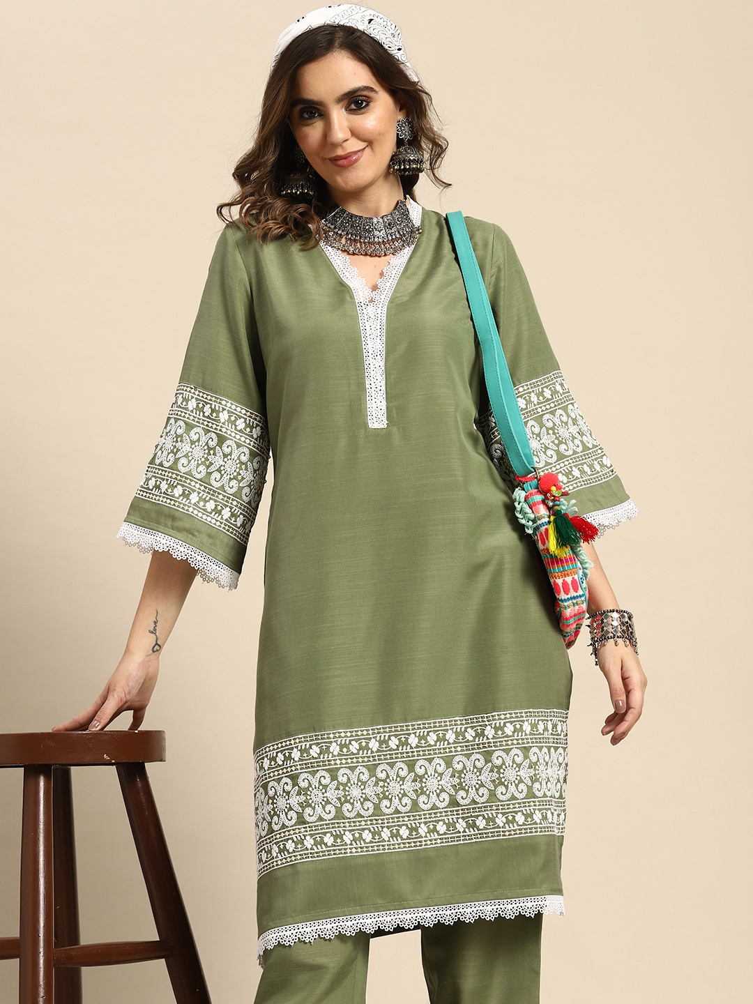 

Sangria Women Ethnic Motifs Thread Work Kurta with Trousers, Olive