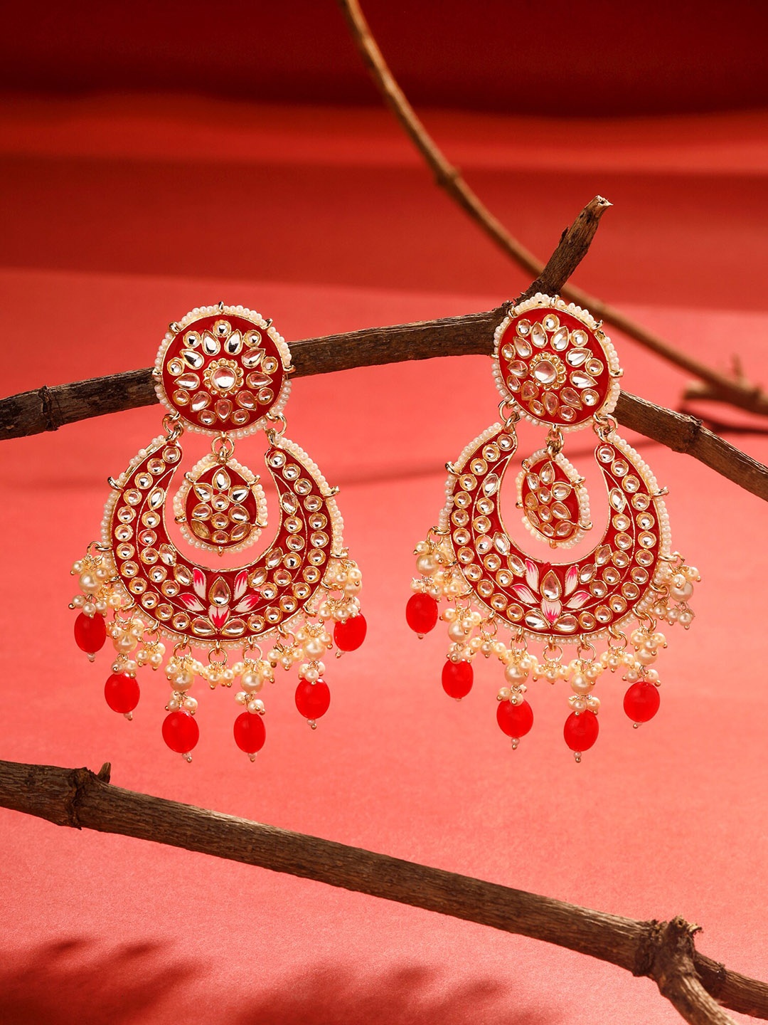 

Yellow Chimes Gold-Plated Crescent Shaped Chandbalis Earrings, Red