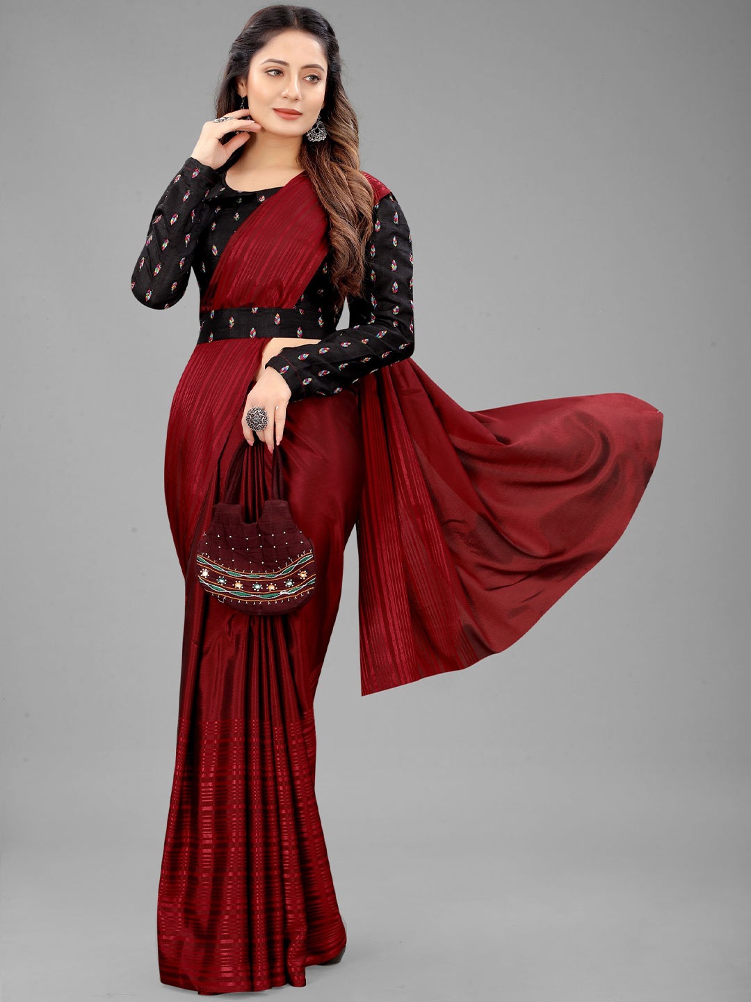 

Rangrasiya Corporation Striped Bordered Ikat Saree, Maroon