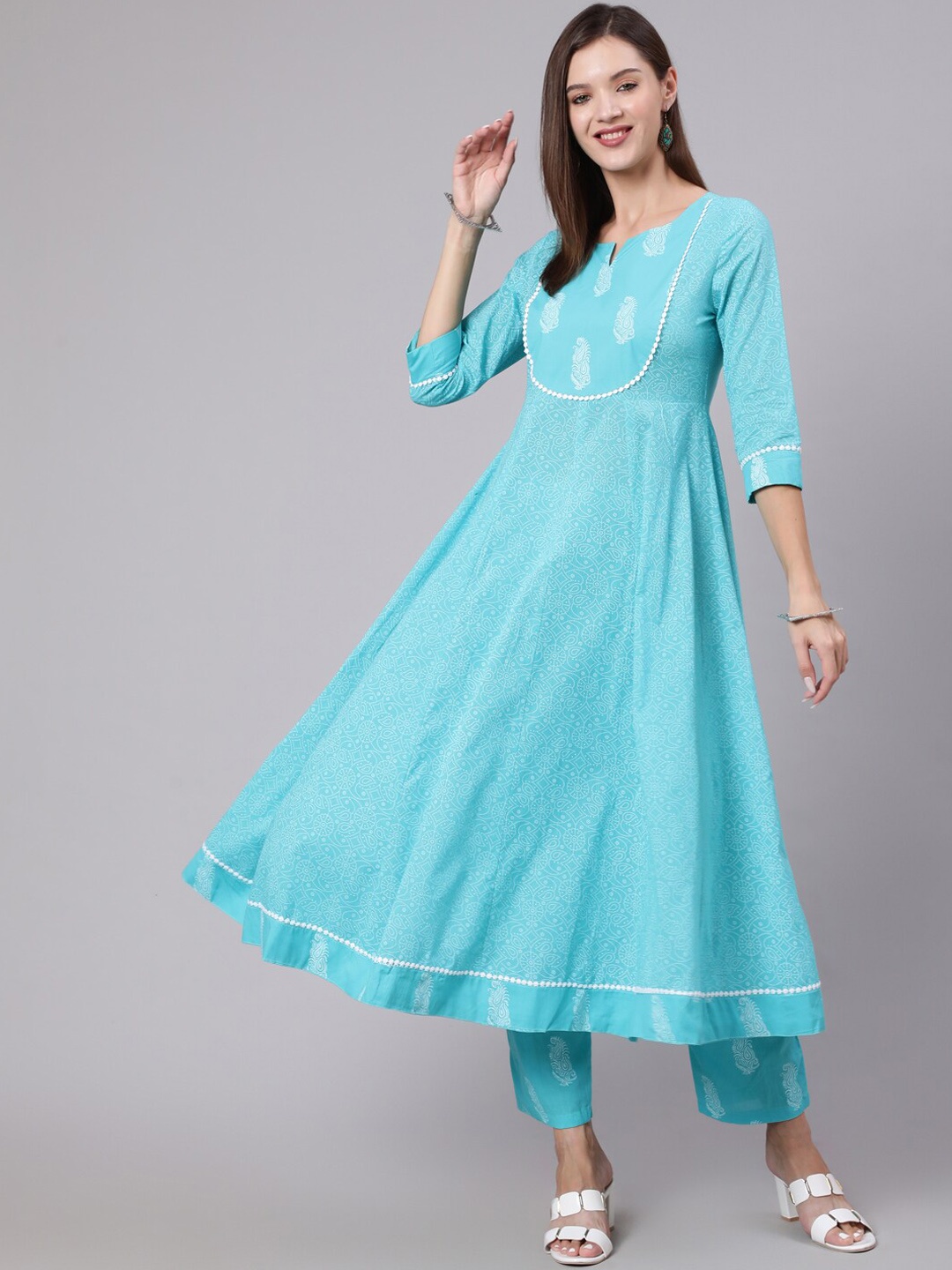 

KIMAYRA Women Floral Printed Pure Cotton Kurta With Trousers, Turquoise blue