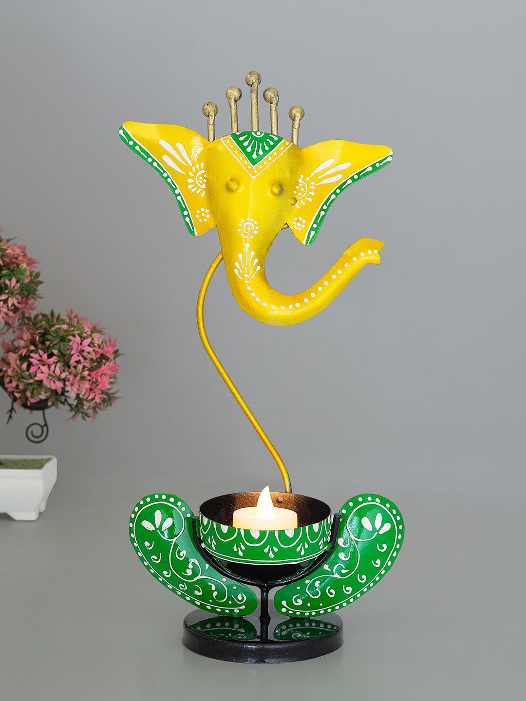 

Golden Peacock Yellow & Green Ganesha Tea Light Candle Holder