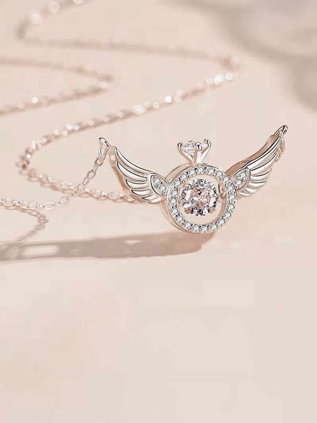 

Designs By Jewels Galaxy Silver-Plated Stone-Studded Angel Wings Pendant With Chain