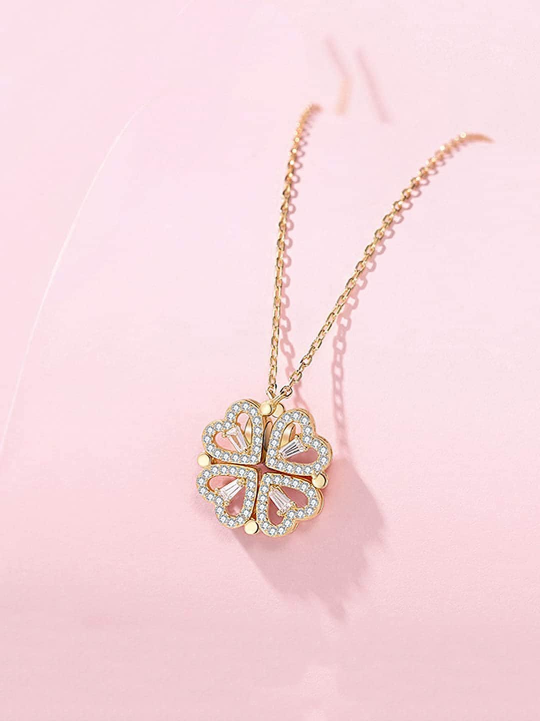 

Designs By Jewels Galaxy Gold-Plated Stone-Studded Four Hearts Openable Magnet Pendant with Chain