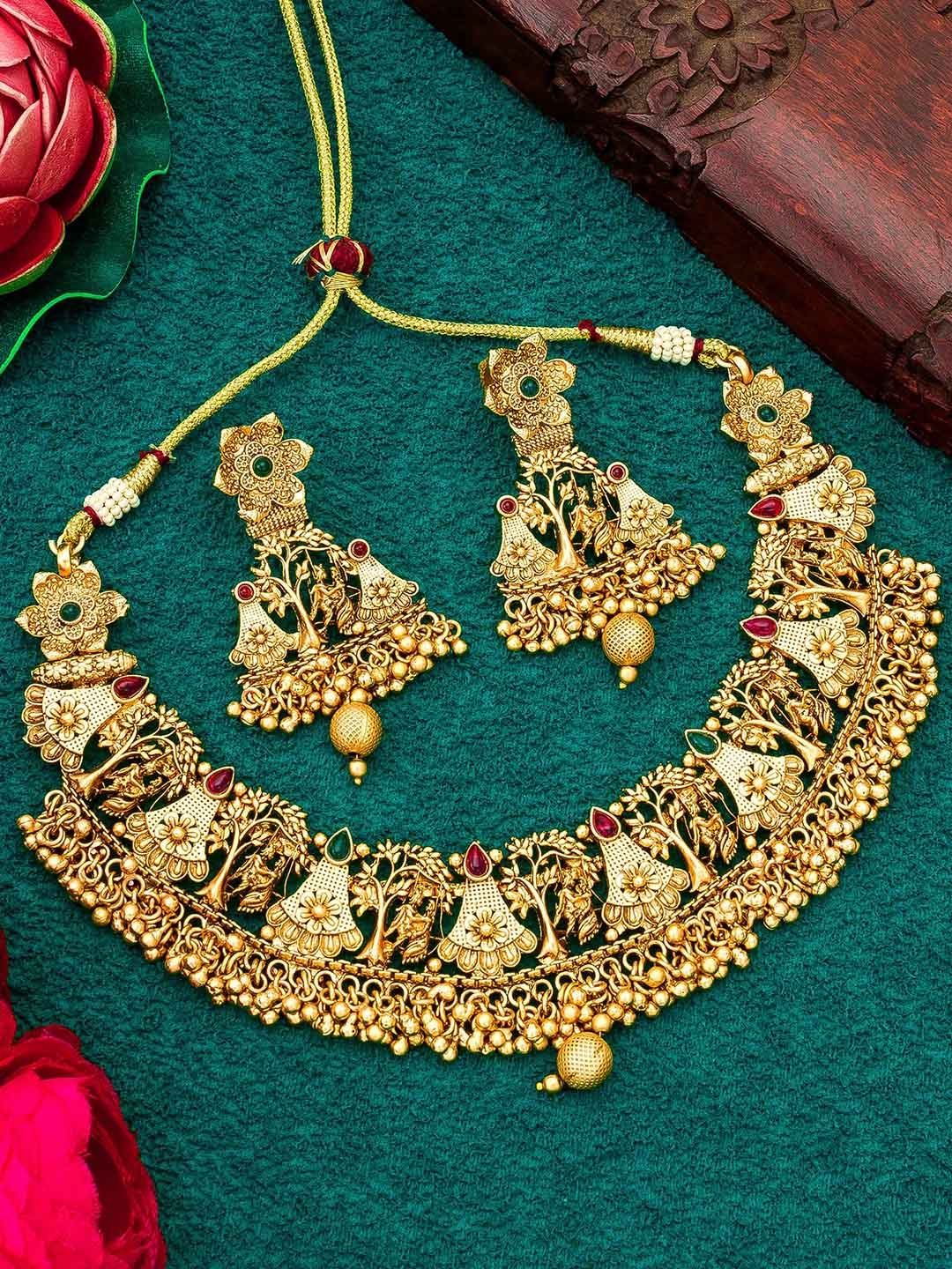 

aadita Gold-Plated Stones Studded & Beaded Jewellery Set