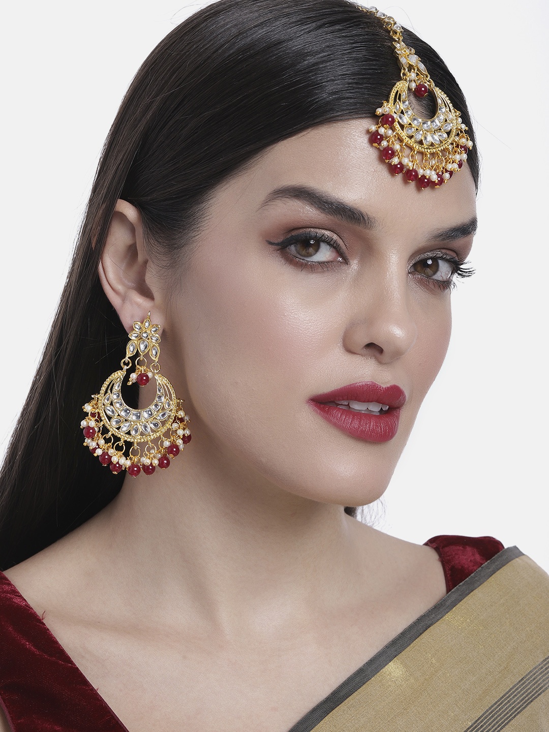 

Peora Traditional Gold-Plated Kundan & Pearl Maang Tika & Earrings Jewellery Set, Maroon