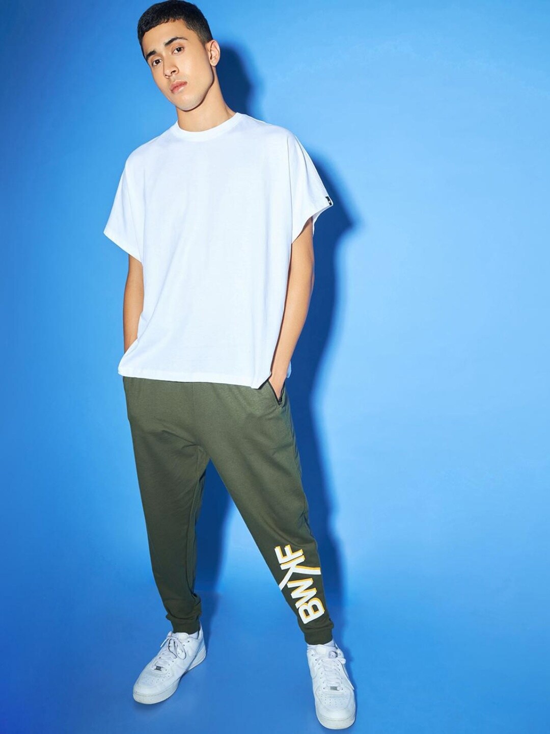 

Bewakoof Men Typographic Print Loose-Fit Cotton Joggers, Green