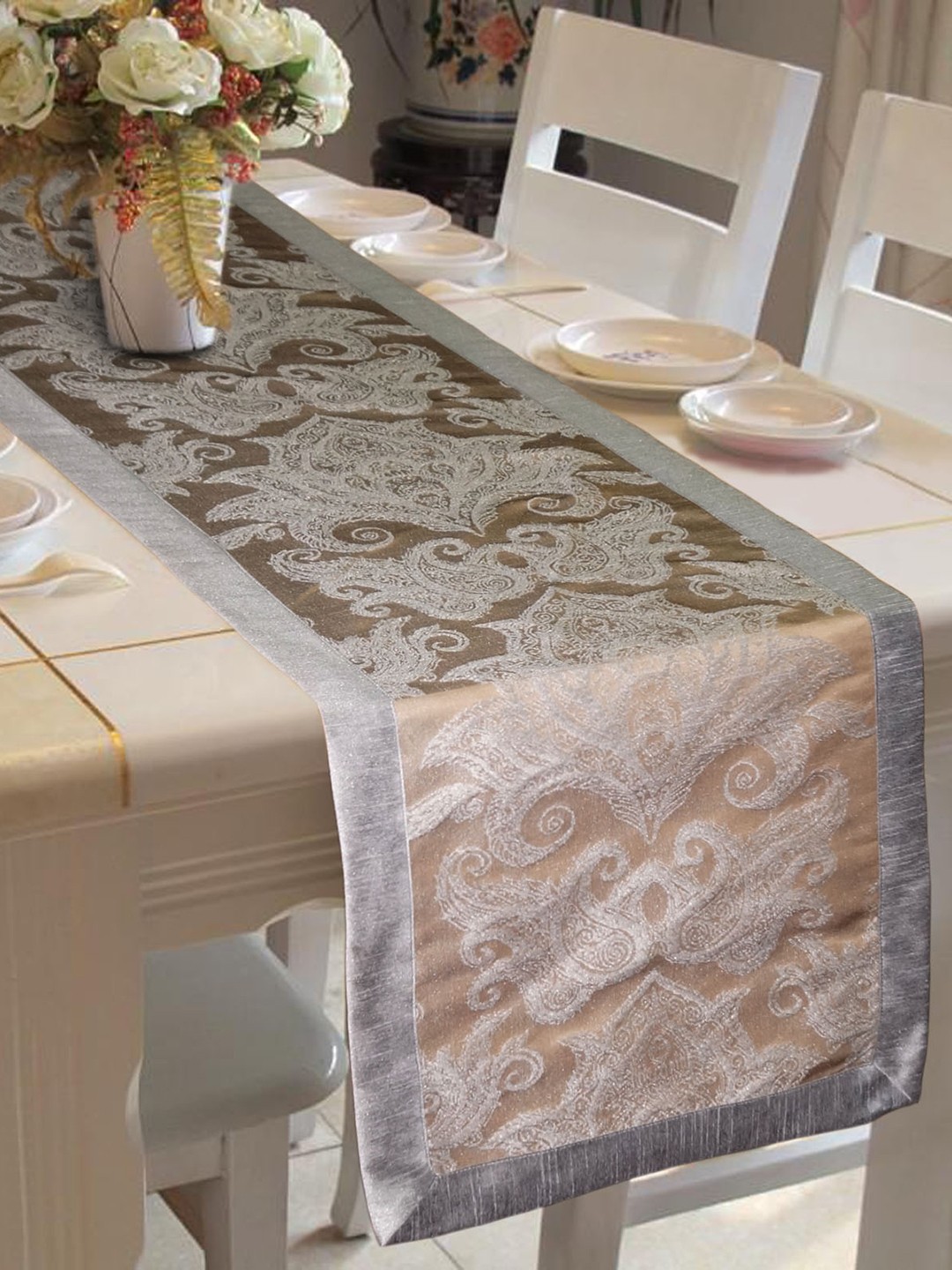 

Lushomes Brown and Silver-Toned Ethnic Jacquard Rectangular Table Runner
