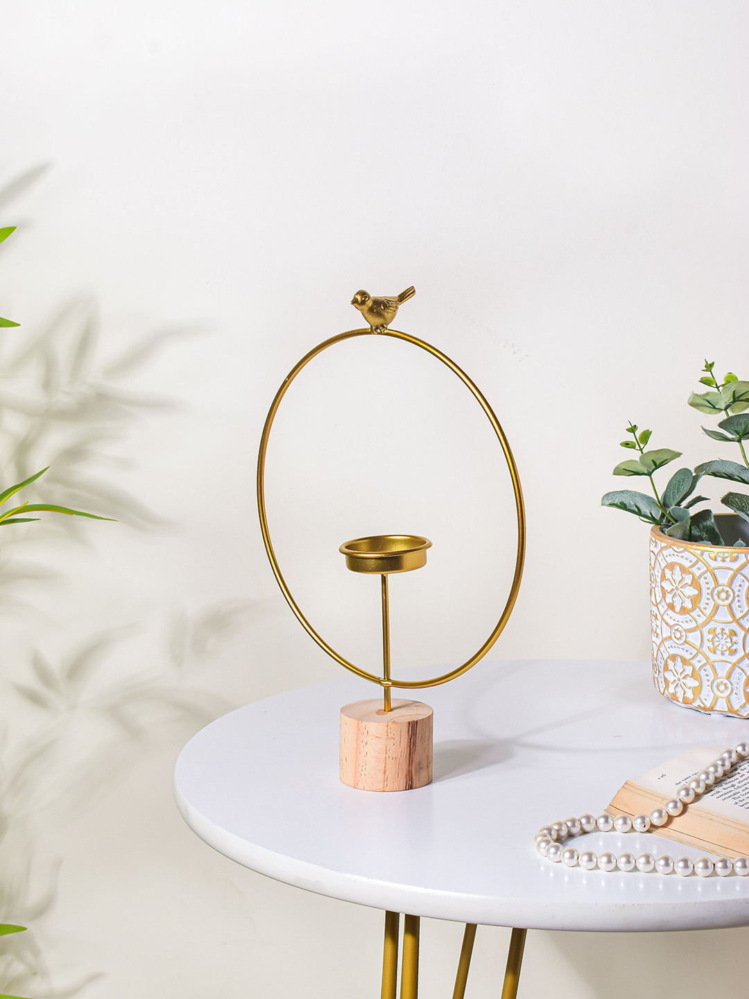 

Nestasia Gold Toned and Beige Tealight Candle Holder
