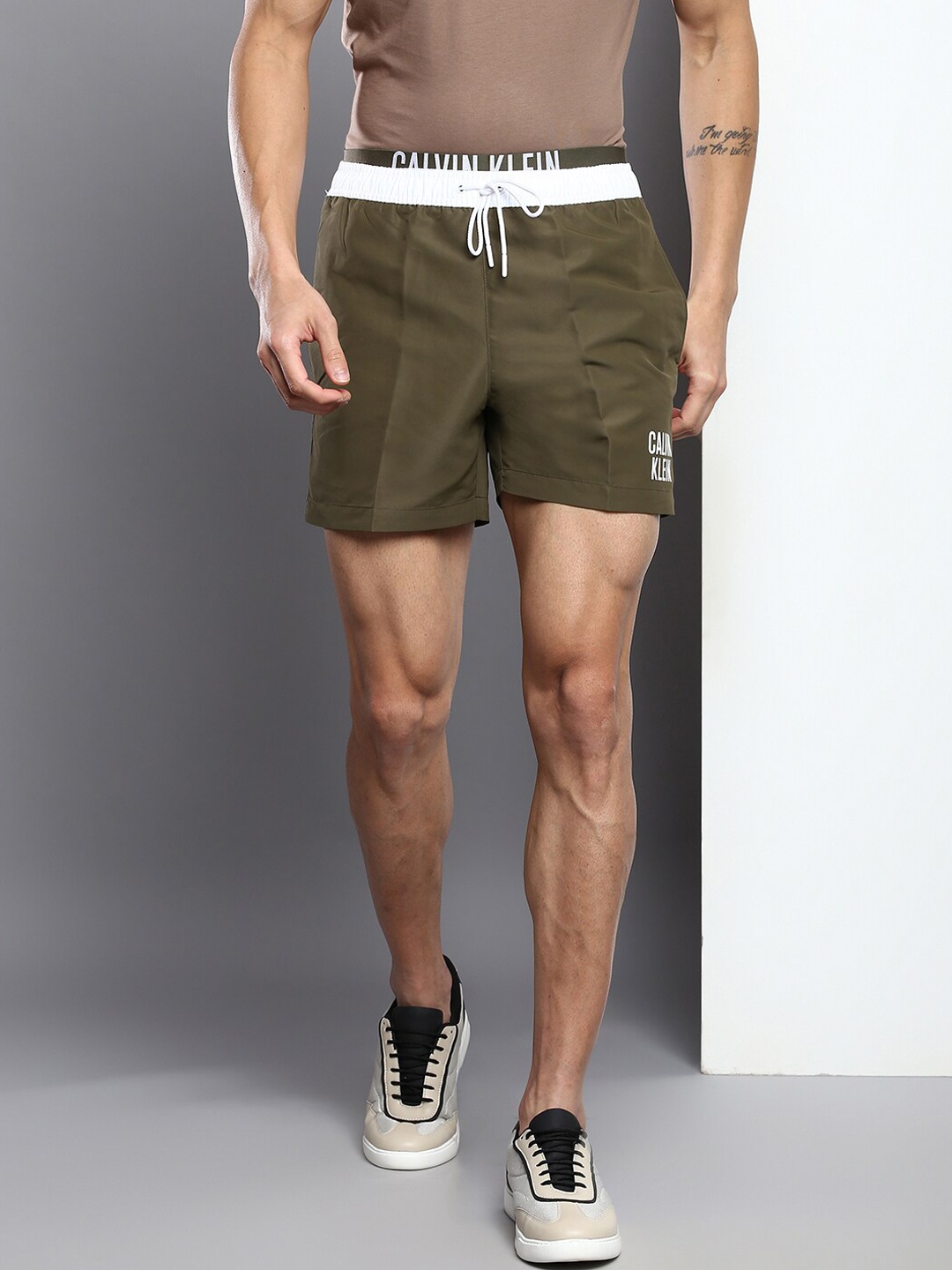 

Calvin Klein Jeans Men Typography Printed Shorts, Olive