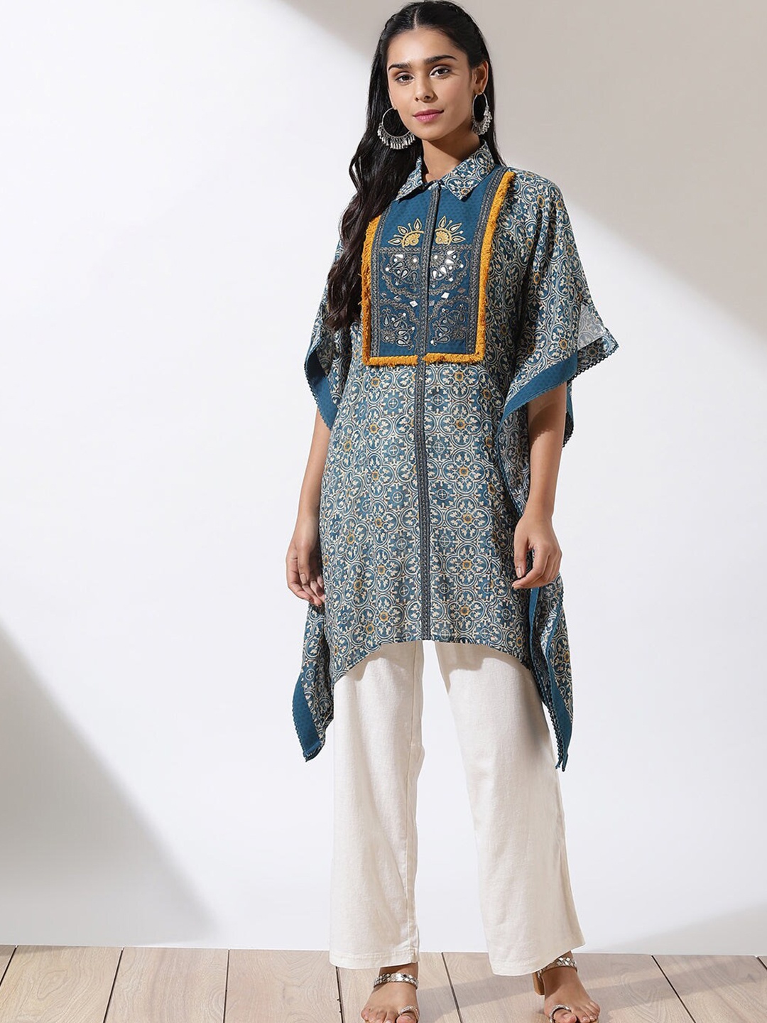 

Lakshita Plus Size Printed Shirt Collar Flared Sleeves Mirror Work Kaftan Kurti, Teal