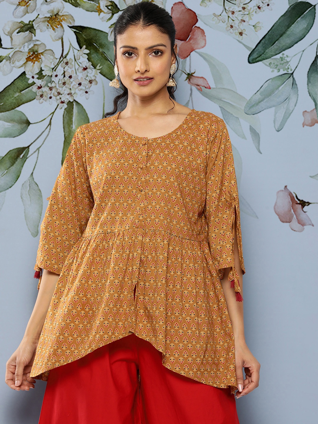 

Libas Floral Printed Flared Sleeves Pure Cotton Empire Tassels Details Kurti, Mustard