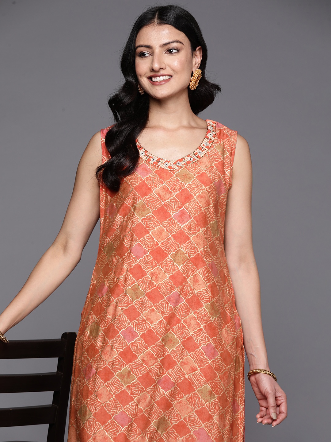 

Libas Women Ethnic Motifs Printed Mirror Work Kurta with Trousers, Orange
