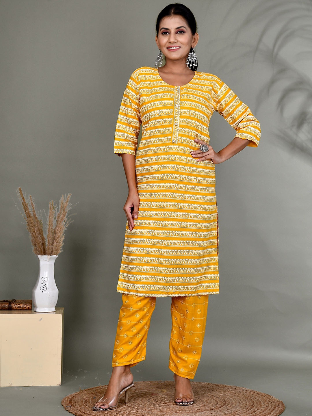 

Kesarya Women Printed Kurta with Trousers, Yellow