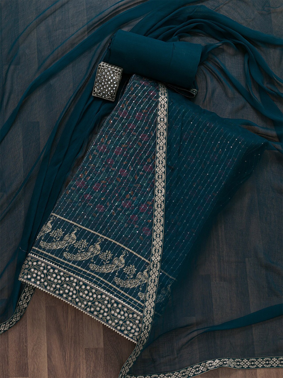 

Koskii Embellished Semi-Stitched Dress Material, Teal