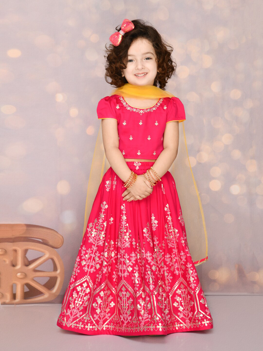 

SAKA DESIGNS Girls Magenta & Yellow Embroidered Foil Print Ready to Wear Lehenga Choli