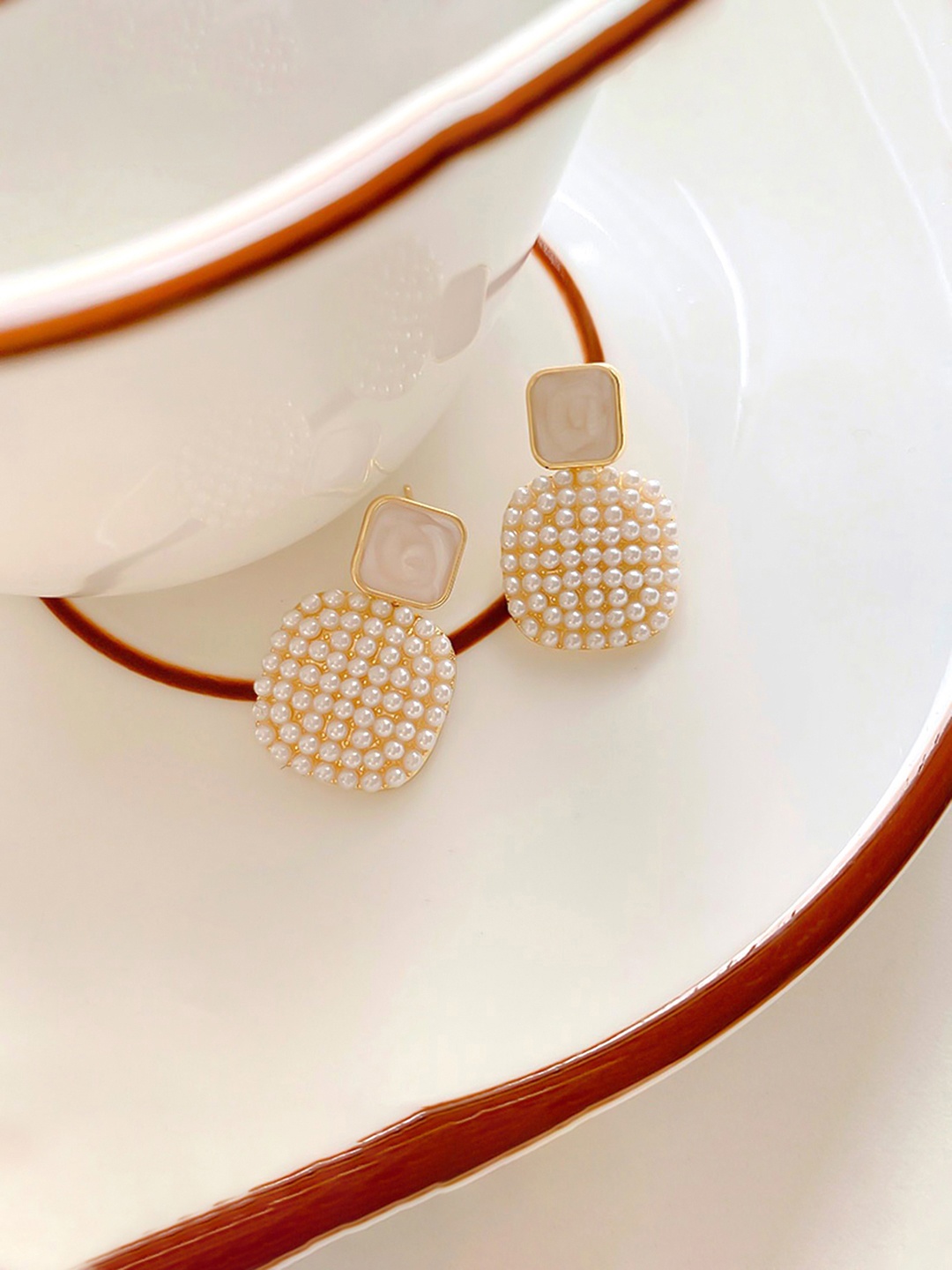 

Yellow Chimes Pearl Studded Geometrical Drop Earrings, White