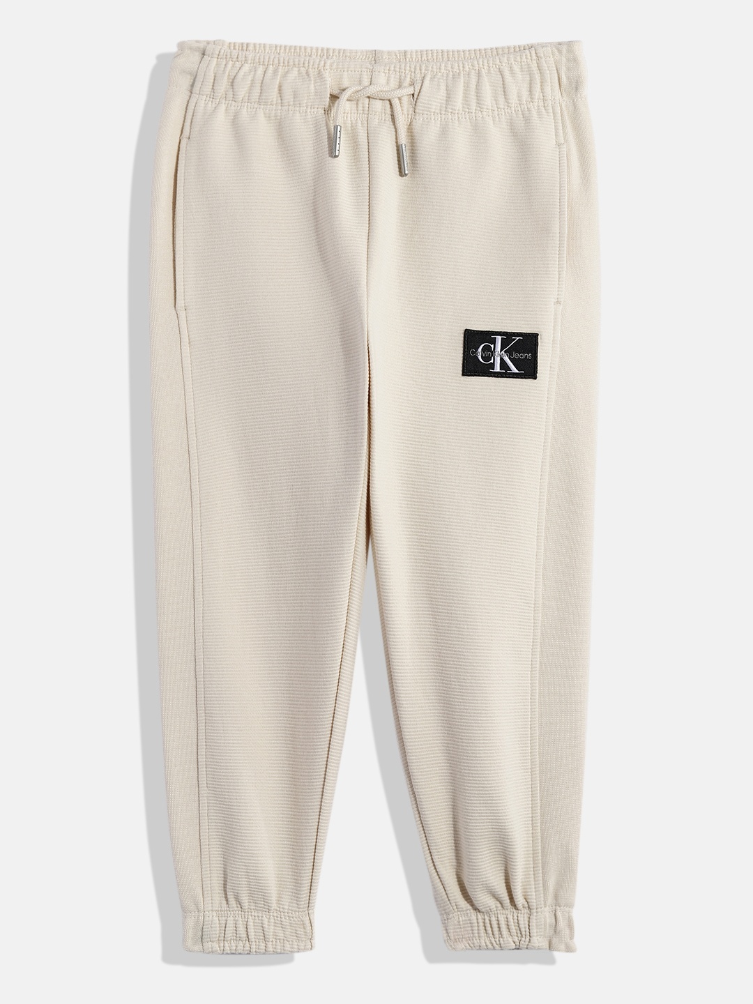 

Calvin Klein Boys Textured Regular Fit Mid-Rise Organic Cotton Joggers With Applique, Beige