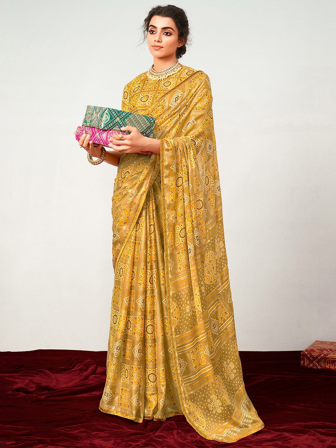 

Saree mall Printed Ethnic Motifs Pure Georgette Patola Sarees, Mustard