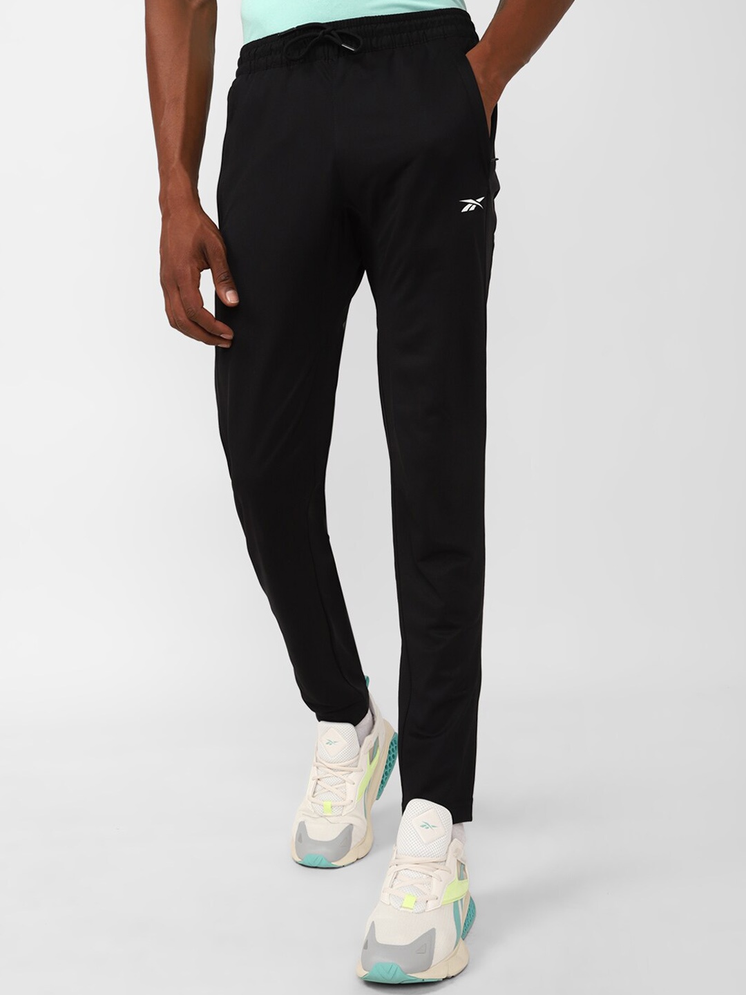 

Reebok Men WOR Knit Trackster Pants, Black