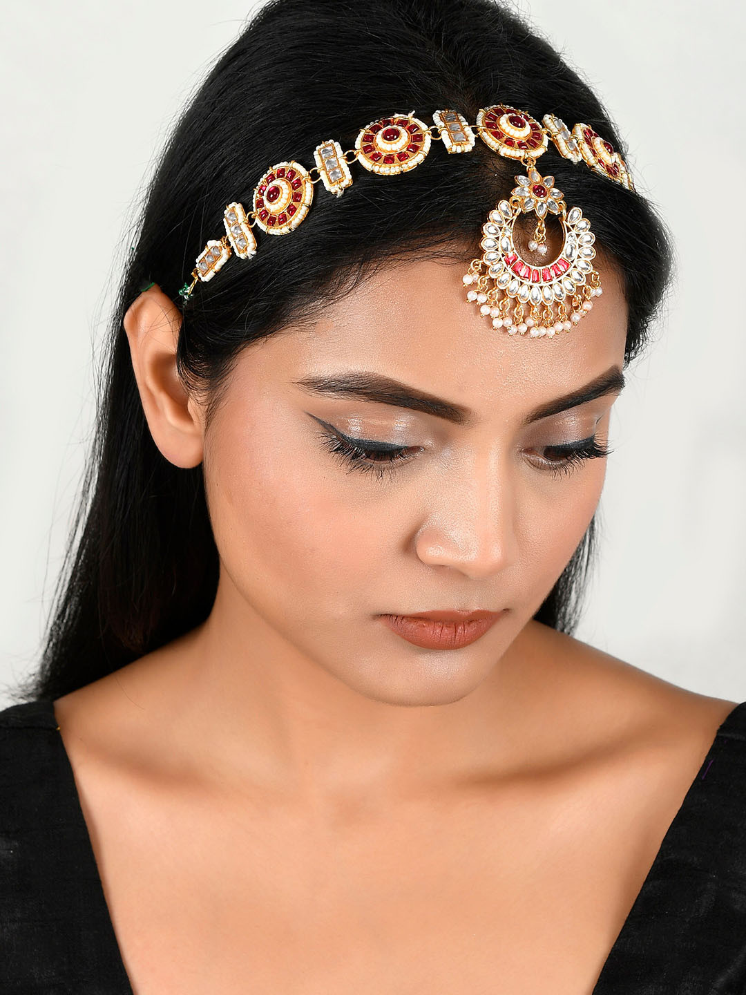 

Silvermerc Designs Women Gold-Plated & Kundan Studded Matha Patti, Red