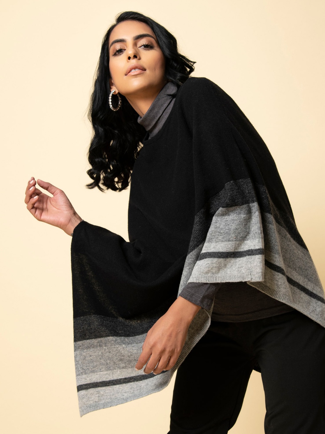 

KHALEEJ Women Striped Wool Poncho Sweater, Black