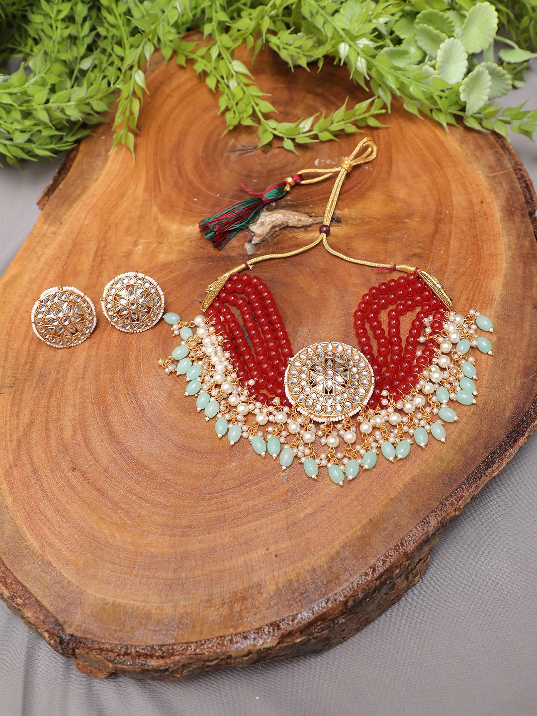 

Swarajshop Gold-Plated Kundan Studded & Beaded Jewellery Set, Red