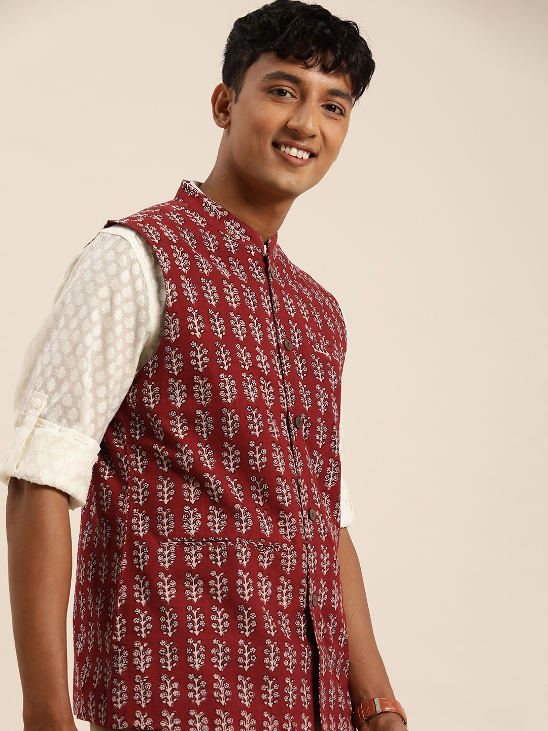 

Taavi Mandarin Collar Floral Printed Rustic Dabu Nehru Jacket, Maroon