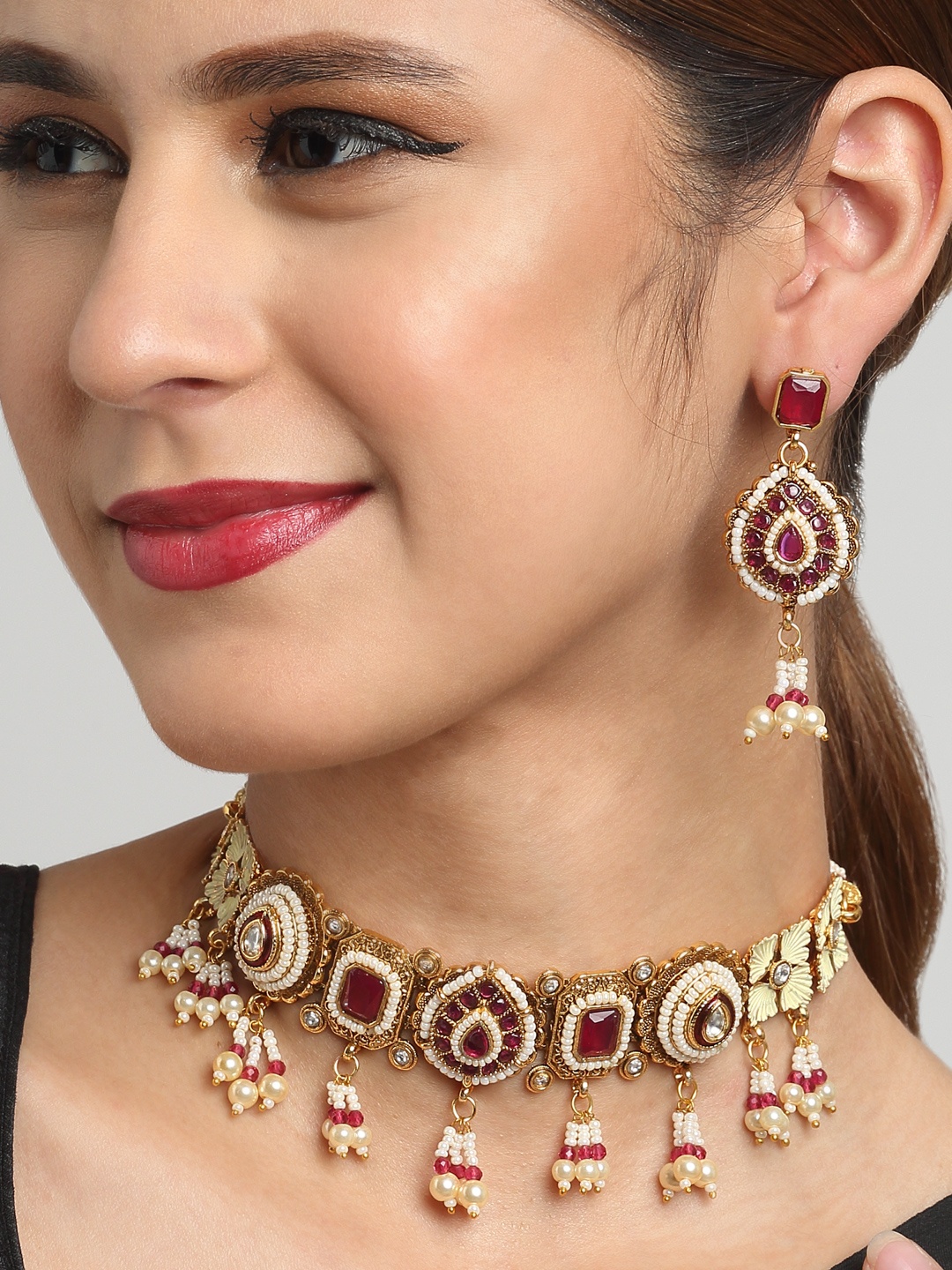 

YouBella Gold-Plated Red Artificial Stone & Beaded Jewellery Set