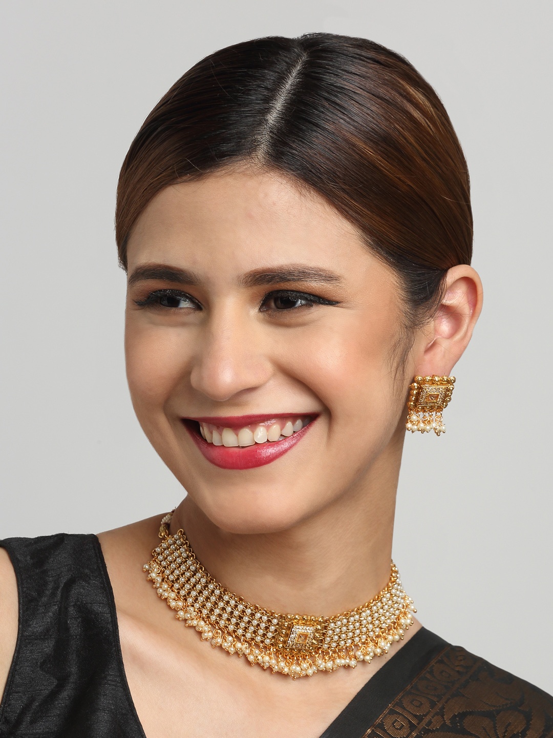 

YouBella Gold-Plated Stones Studded & Beaded Jewellery Set