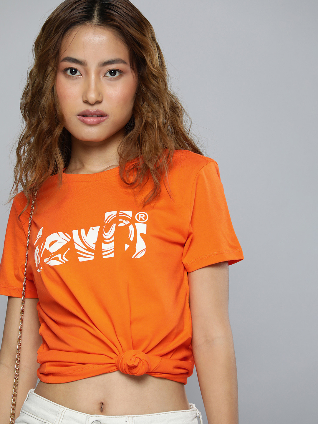

Levis Women Pure Cotton Graphic Brand Logo Printed T-shirt, Orange