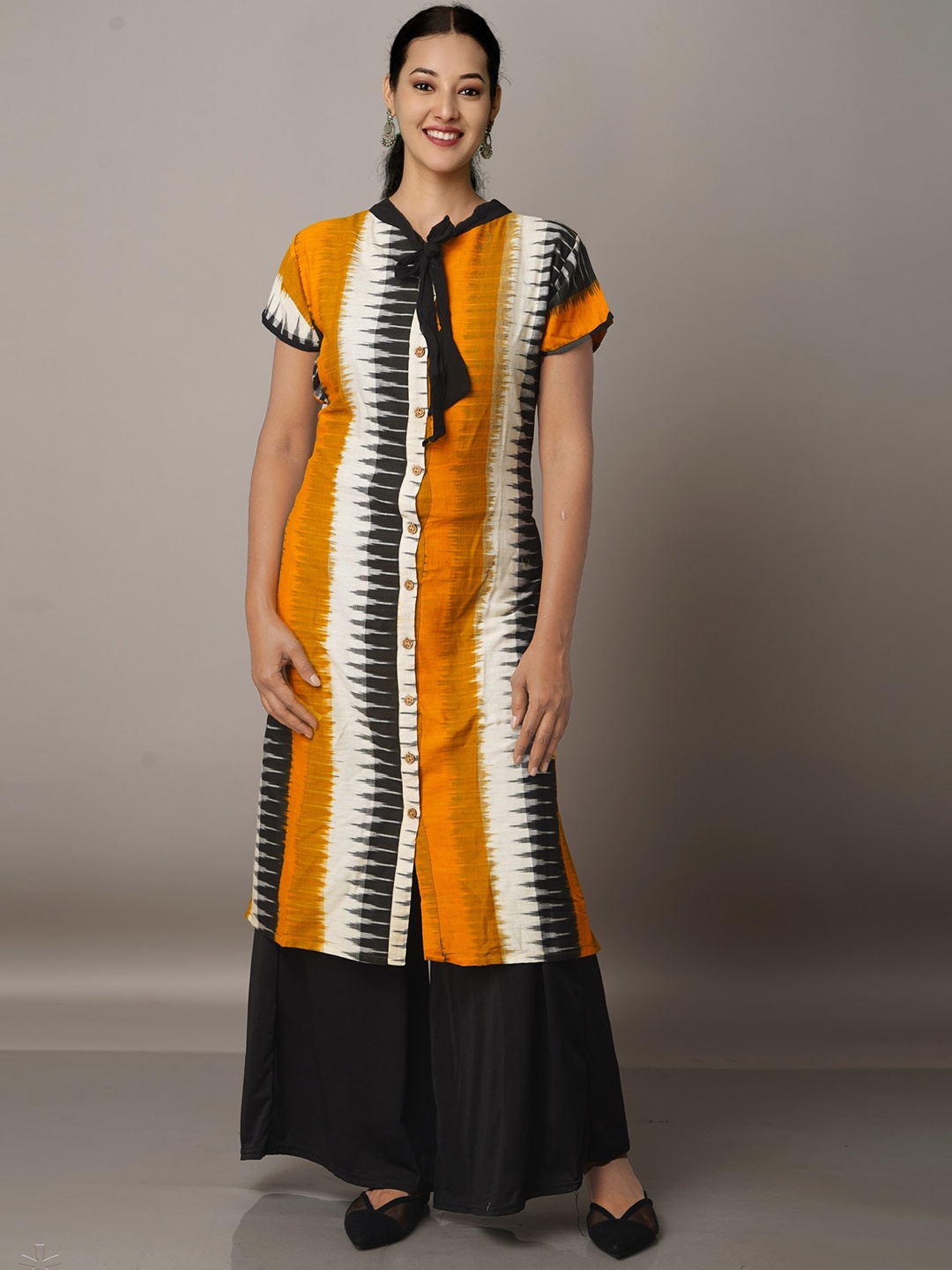 

Unnati Silks Women Geometric Printed Thread Work Handloom Cotton Kurta, Yellow