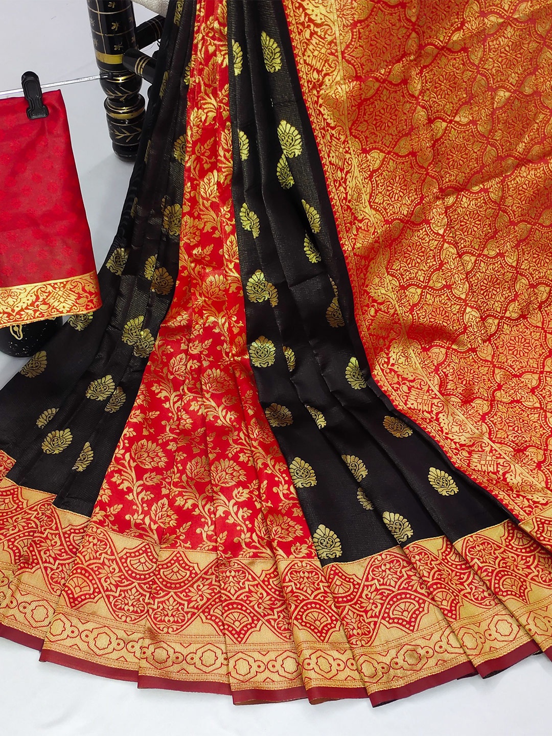 

AADVIKA Black & Red Ethnic Motifs Zari Kanjeevaram Saree