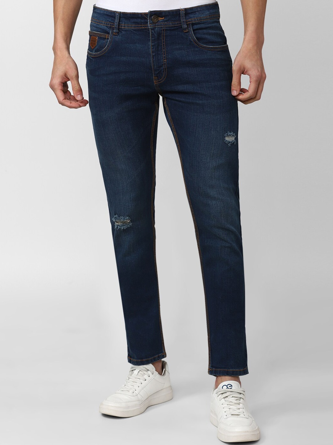 

Peter England Casuals Men Cotton Low Distress Light Fade Jeans, Navy blue