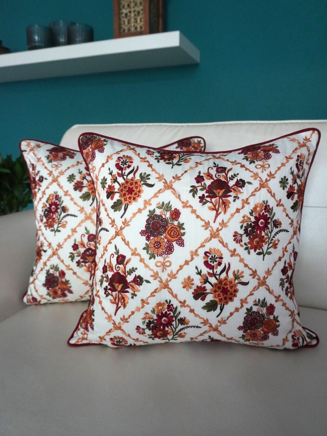 

TARA- Sparkling Homes Maroon & Orange Set of 2 Floral Square Cushion Covers