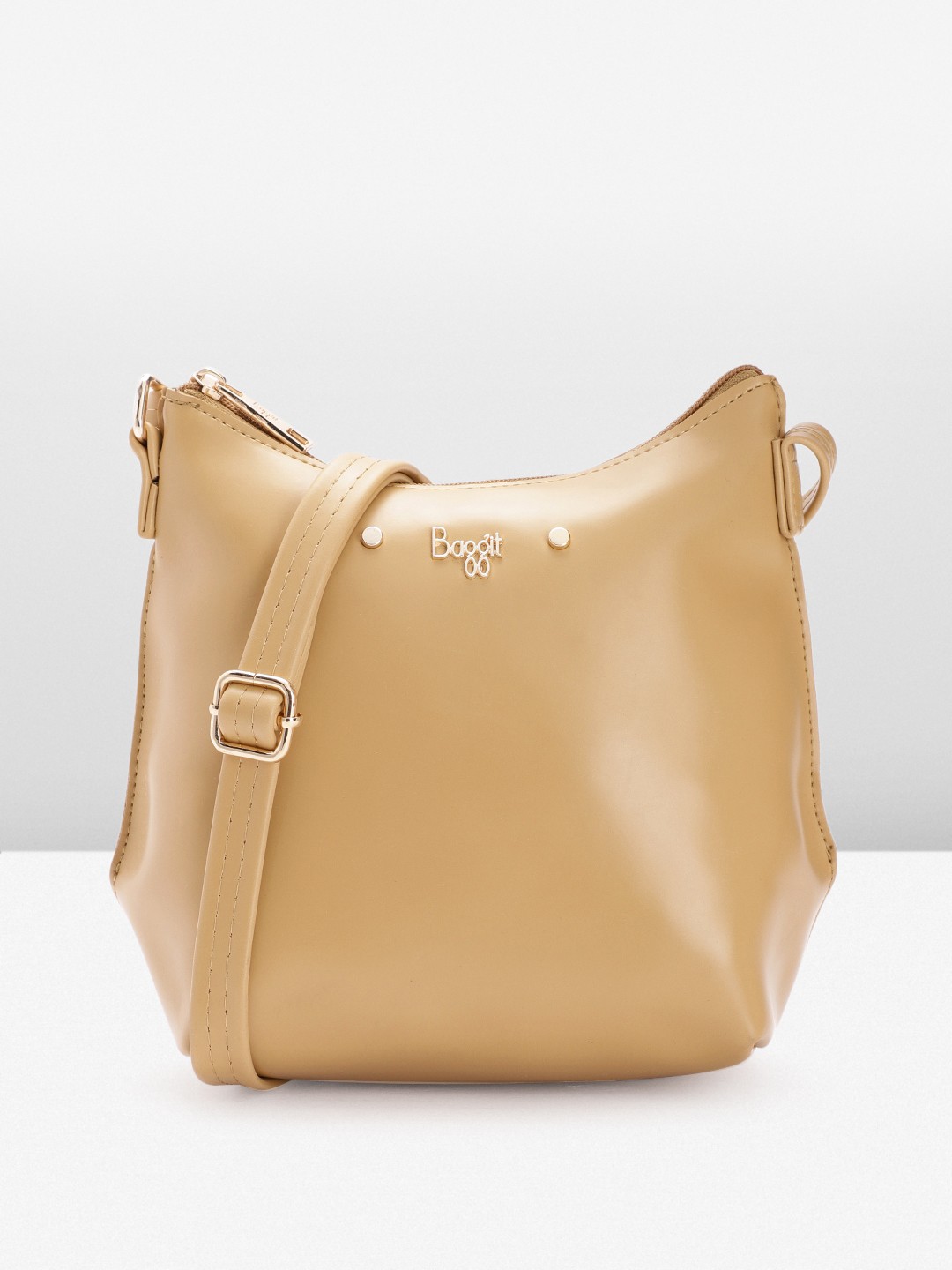

Baggit Women Solid Sling Bag, Beige