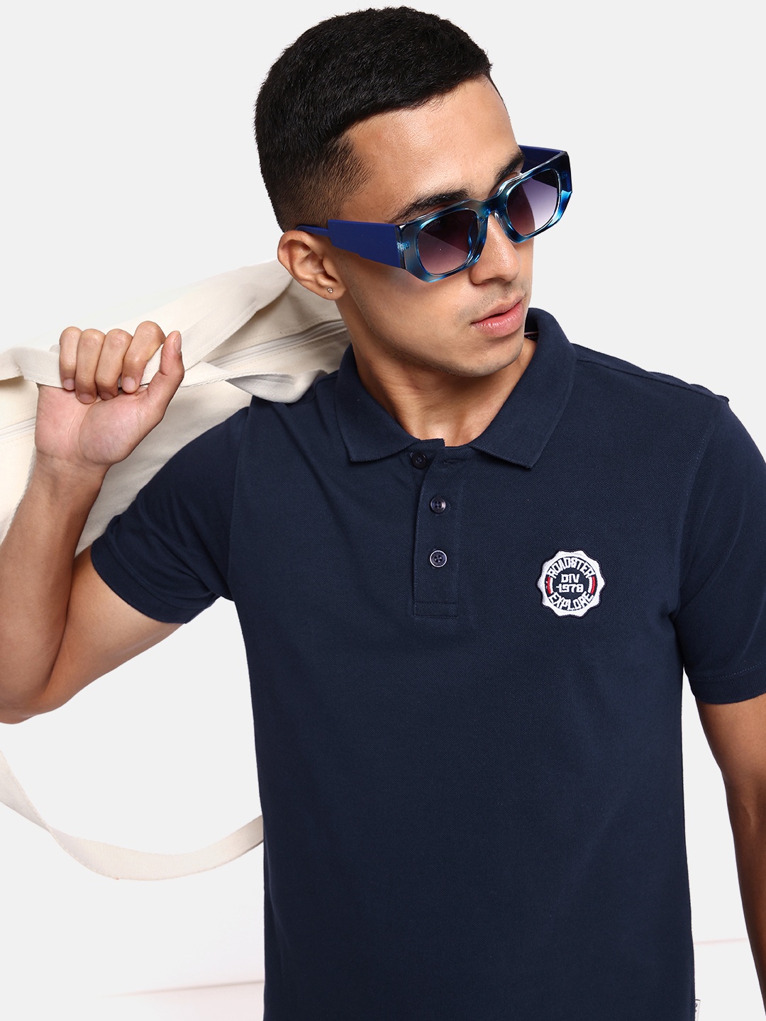 

The Roadster Lifestyle Co. Men Solid Polo Collar Pure Cotton T-shirt, Navy blue